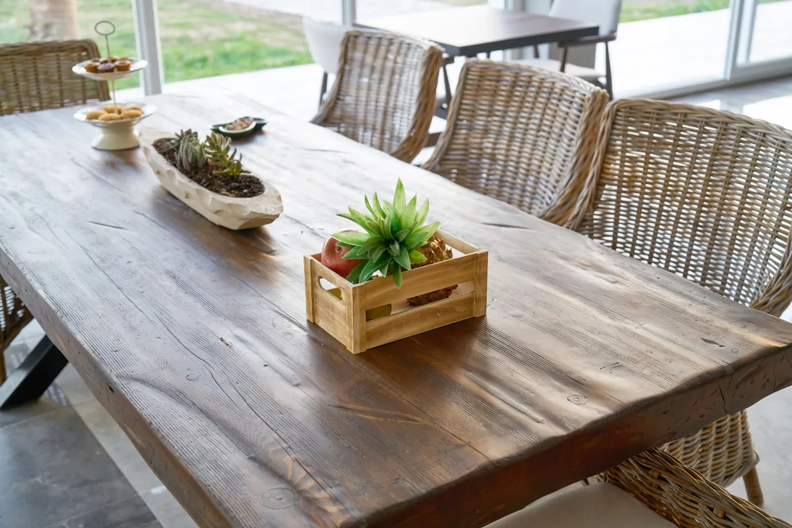 Engineered stone dining table top with place settings demonstrating its hard, non-porous surface