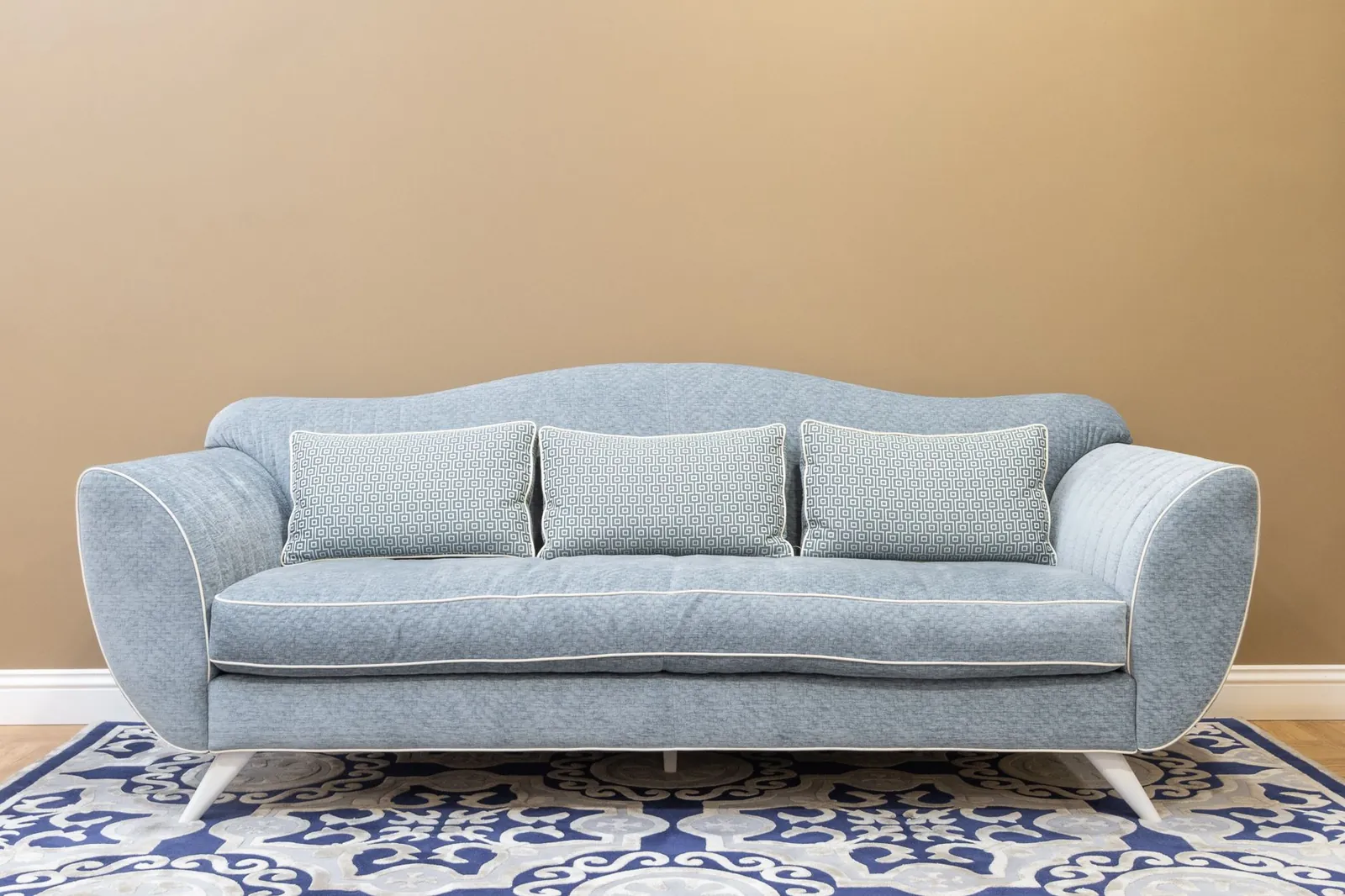 Close-up of microfiber sofa fabric showing tight weave texture and soft appearance