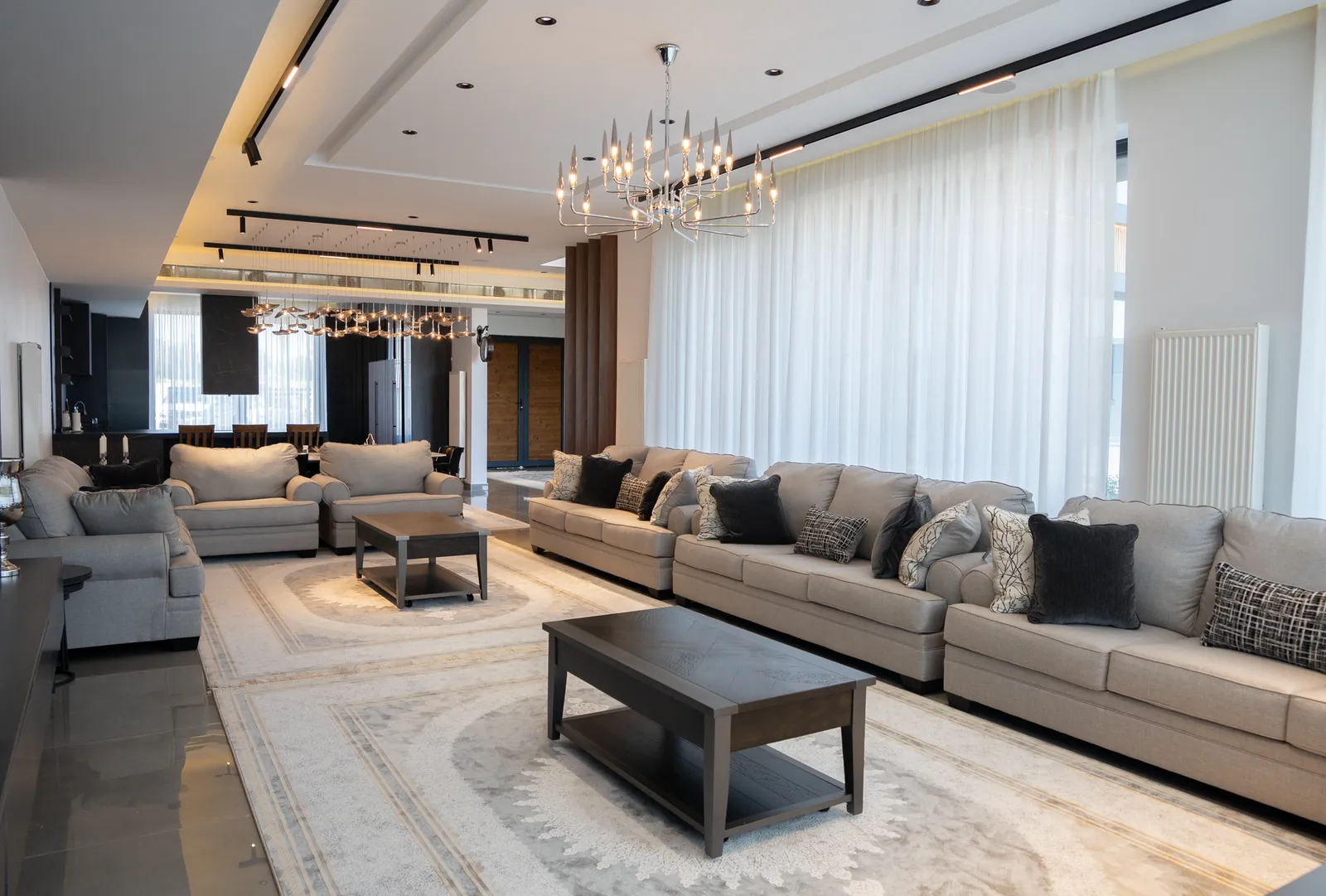 Warm white 2700K LED bulbs in a table lamp beside a sofa, showing the color temperature recommended for living room ambient and accent lighting