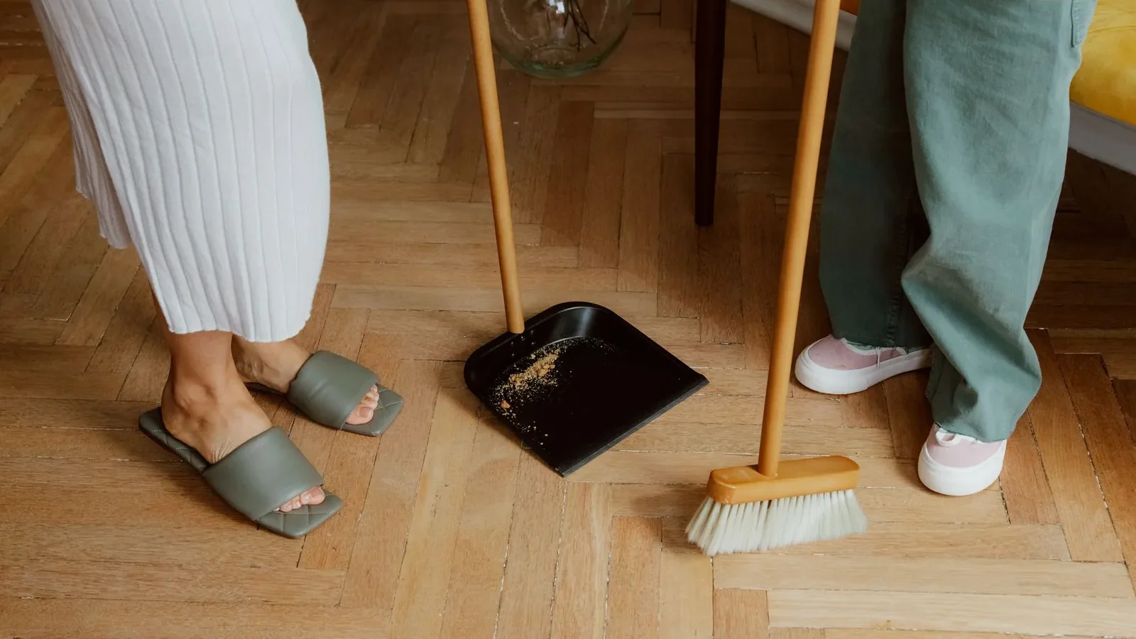 A parent and child loading the dishwasher together during a 5-minute morning kitchen reset