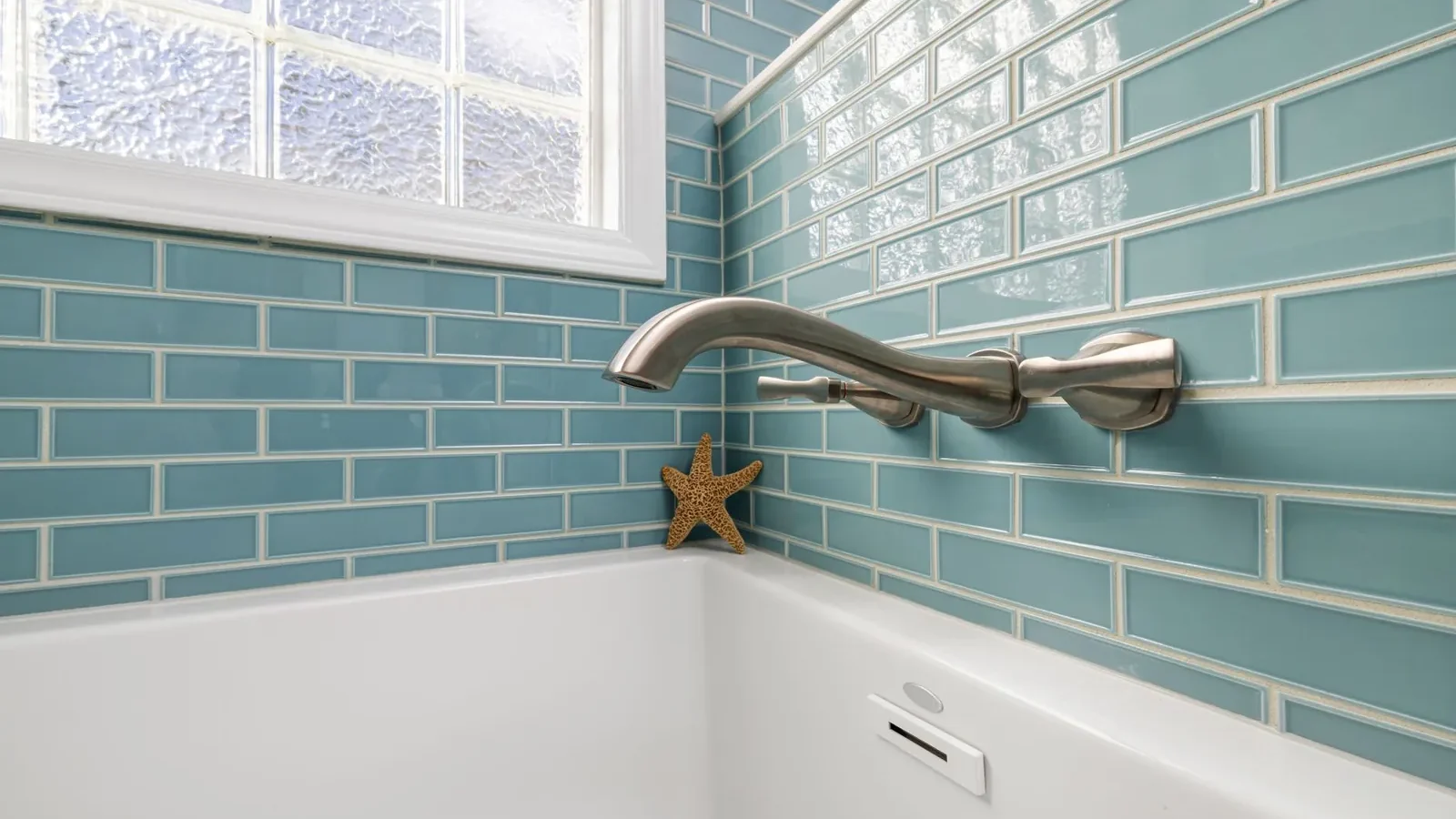 Baking soda paste applied to bathroom grout lines with a small scrub brush