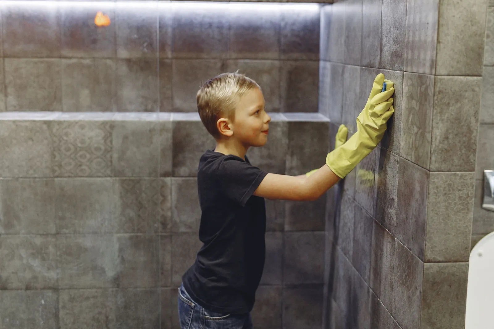 Baking soda and white vinegar fizzing on grout lines during cleaning
