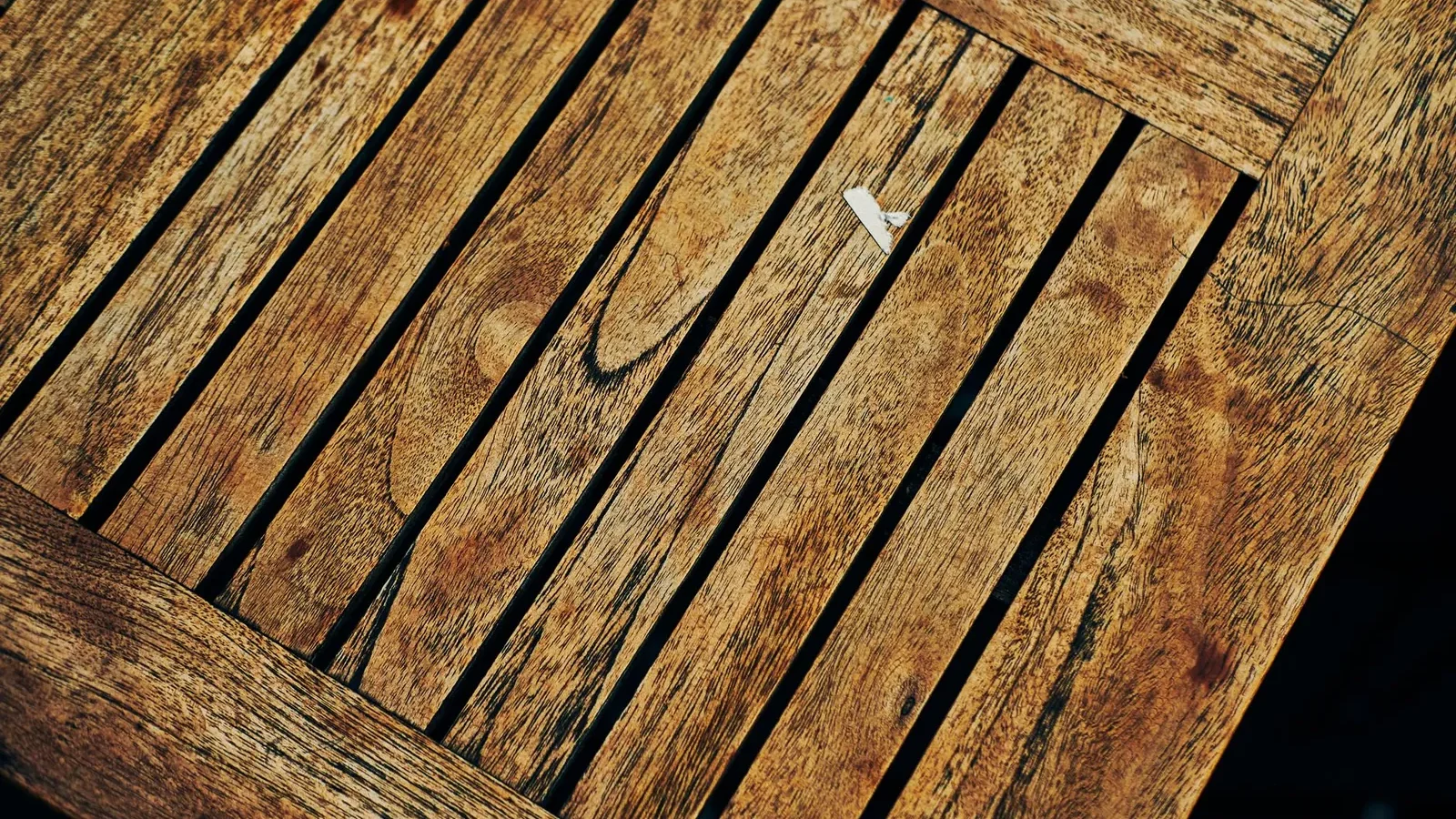 Felt-backed custom table pad fitted over a solid oak dining table surface