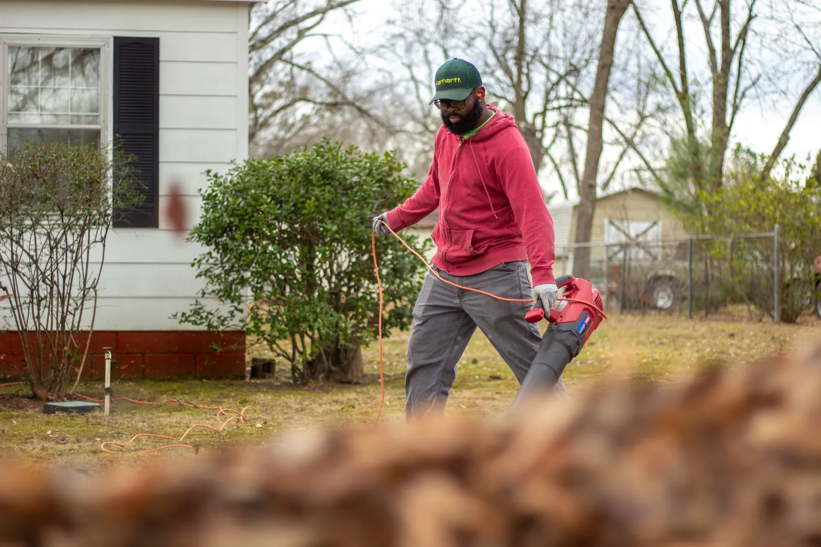 HVAC technician inspecting a home furnace before the winter heating season